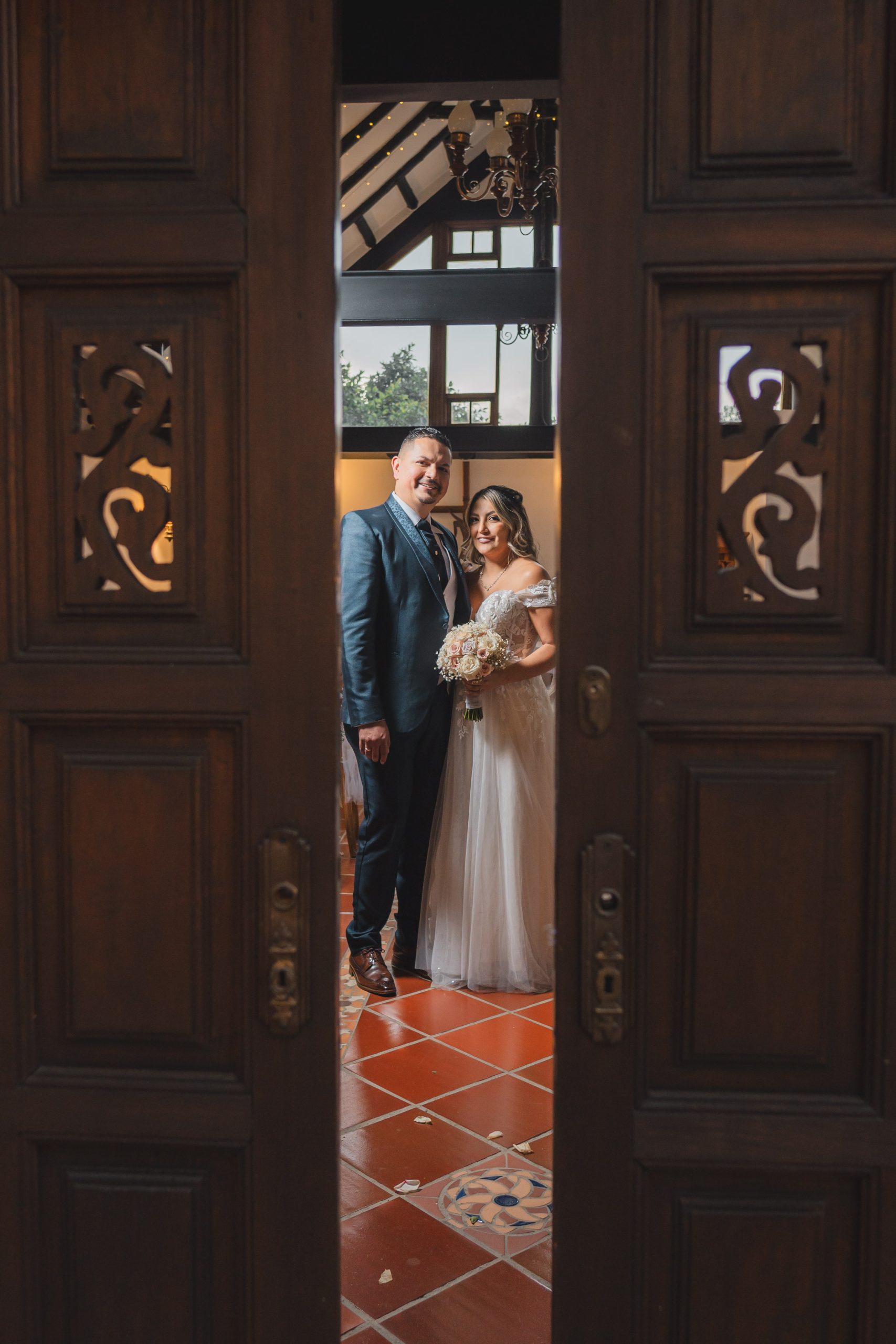 a man and woman standing in front of a door